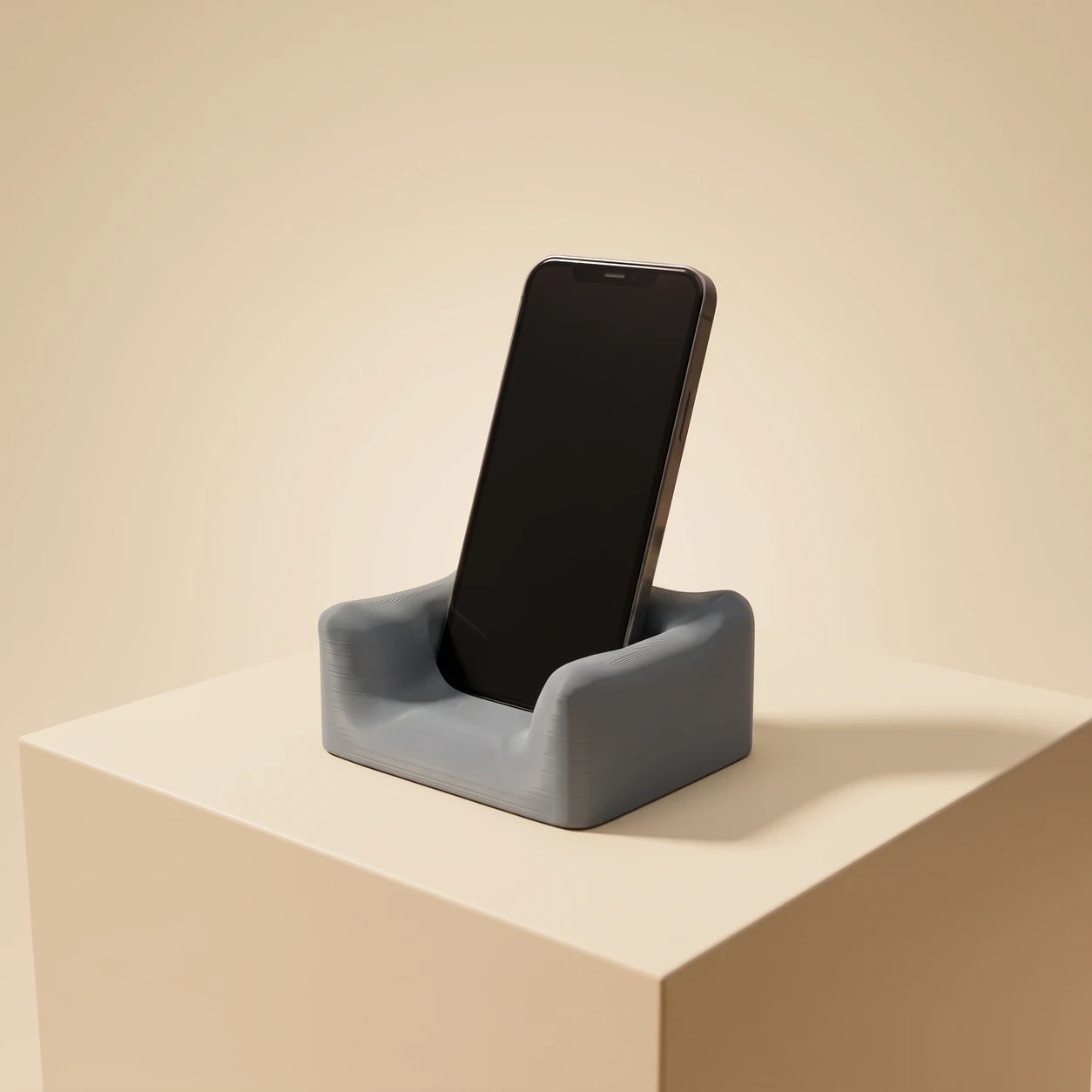The Phone Couch in Moon Grey holding a phone