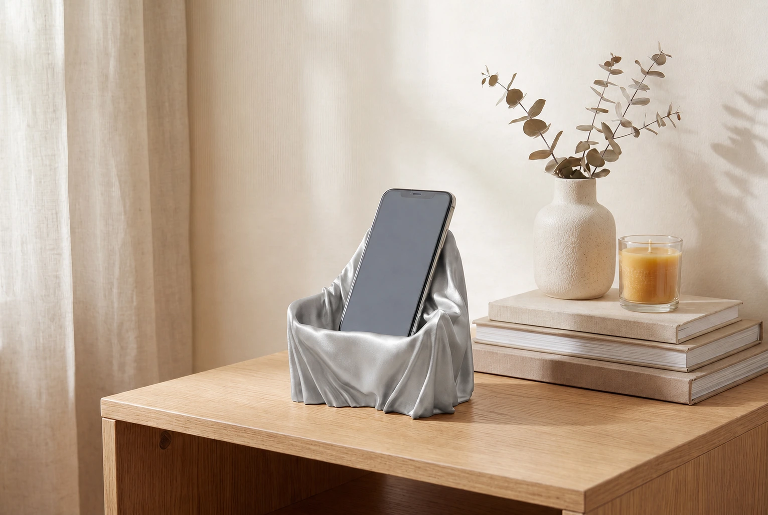 The Silhouette Seat in Silver styled on a bedside table